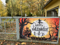 Zoo gate with Happy Halloween sign